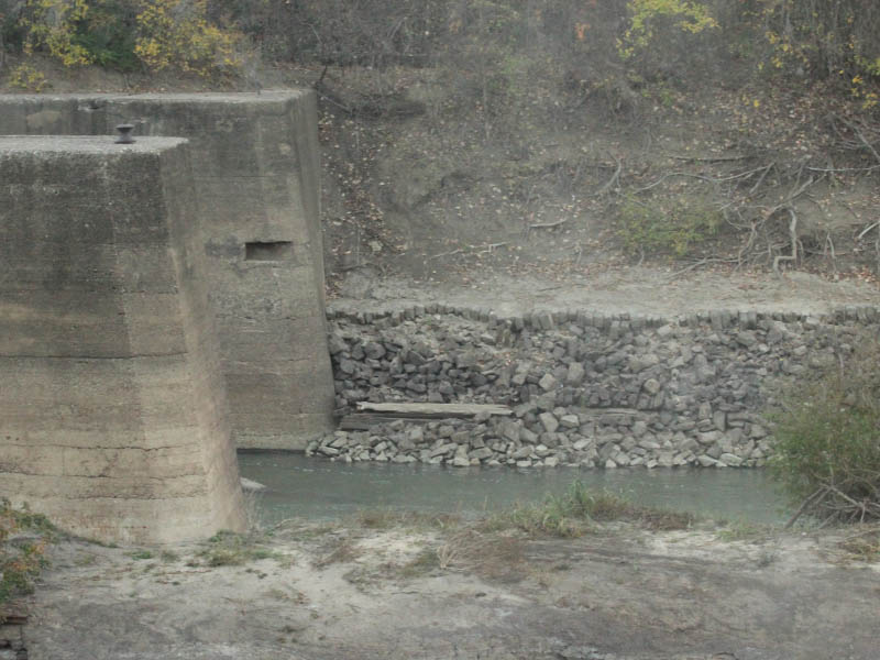 The south end of the lock.  Notice the collapsed stone work along the bank.  