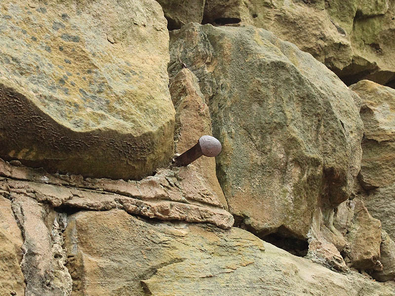 A railroad tie driven into the stone work of the abutment.  Purpose unknown.