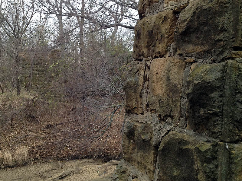 The west side abutment was just barely visible through the tangle of vine and branches on the far side of the river.