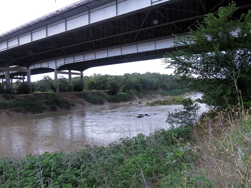 The real Trinity River  as it flows under the massive I-20 bridge.