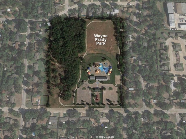 Wayne Frady Park from the air.  The rookery has formed in the wooded area long the west side of the park.